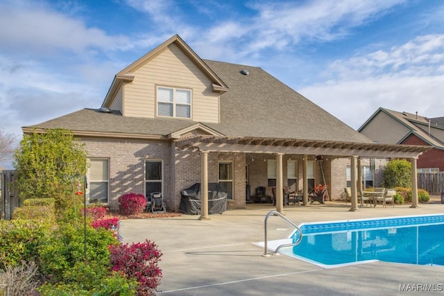 view of swimming pool with a patio area, fence, a fenced in pool, and a pergola