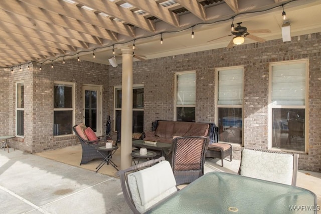 view of patio with an outdoor living space and ceiling fan