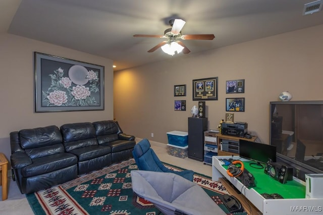 carpeted living room with baseboards, visible vents, and ceiling fan