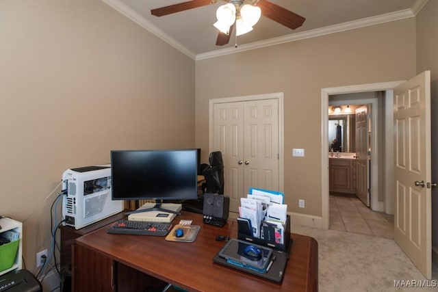 office area featuring baseboards, light colored carpet, ornamental molding, light tile patterned flooring, and a ceiling fan