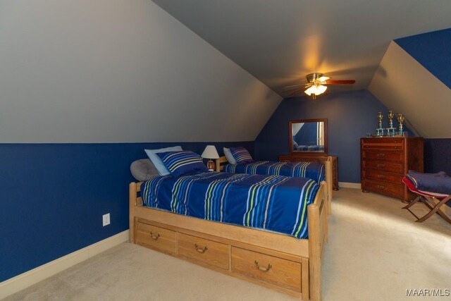 carpeted bedroom featuring baseboards, ceiling fan, and vaulted ceiling