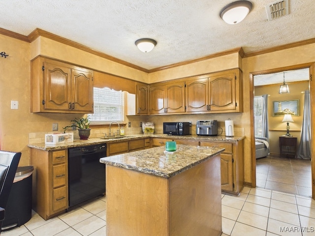 kitchen with visible vents, a sink, black appliances, a textured ceiling, and brown cabinets