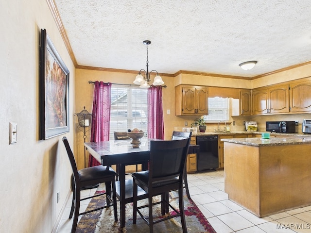 kitchen featuring a sink, black appliances, crown molding, brown cabinets, and a chandelier