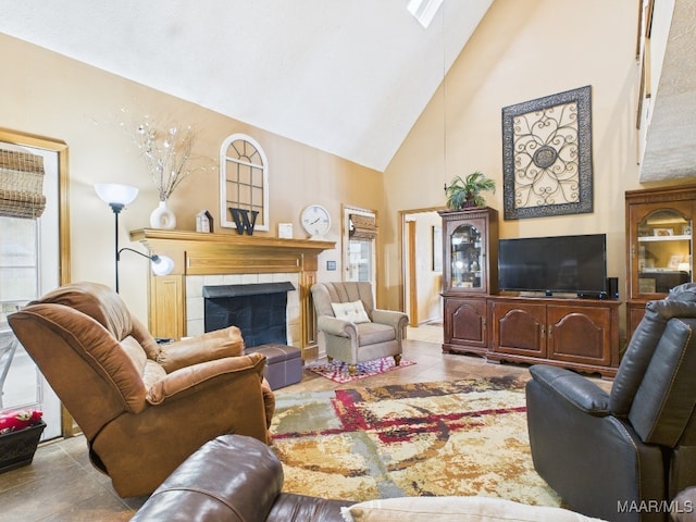 tiled living room featuring high vaulted ceiling and a tiled fireplace