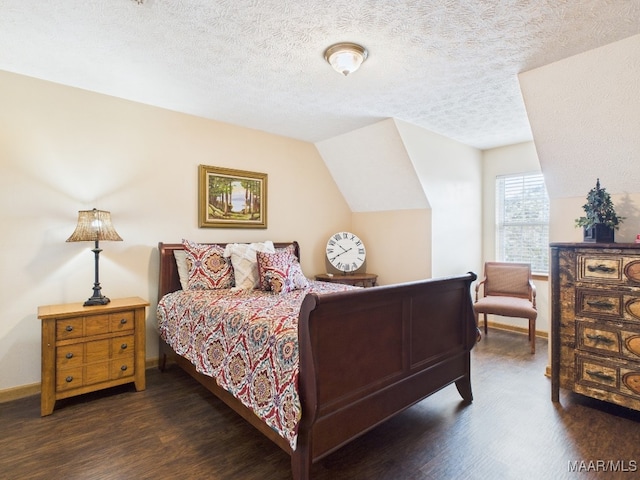 bedroom featuring dark wood finished floors, a textured ceiling, baseboards, and vaulted ceiling