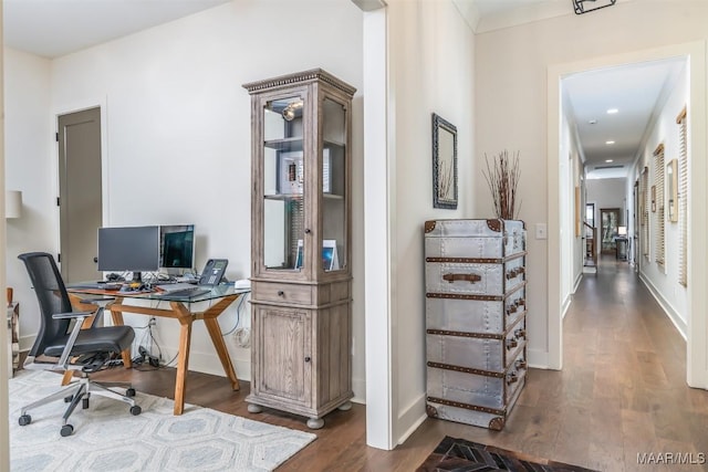 home office with wood finished floors and baseboards