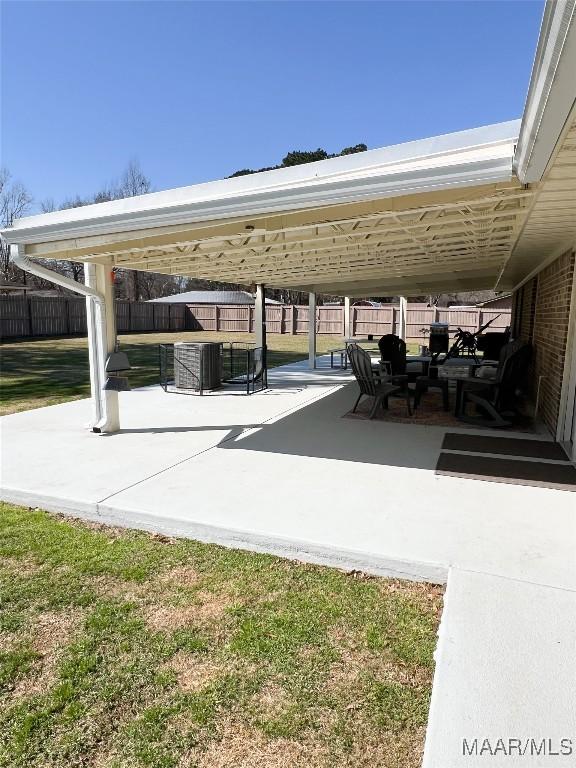 view of patio / terrace with a gazebo and fence