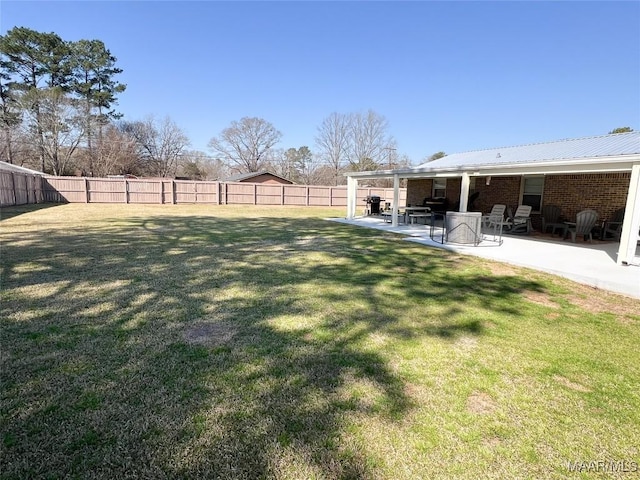 view of yard featuring a fenced backyard and a patio area
