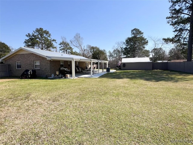 view of yard with a patio area and fence