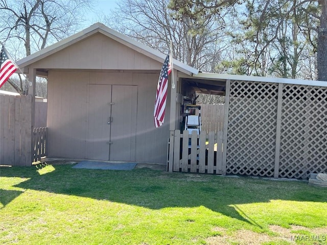 view of shed featuring fence