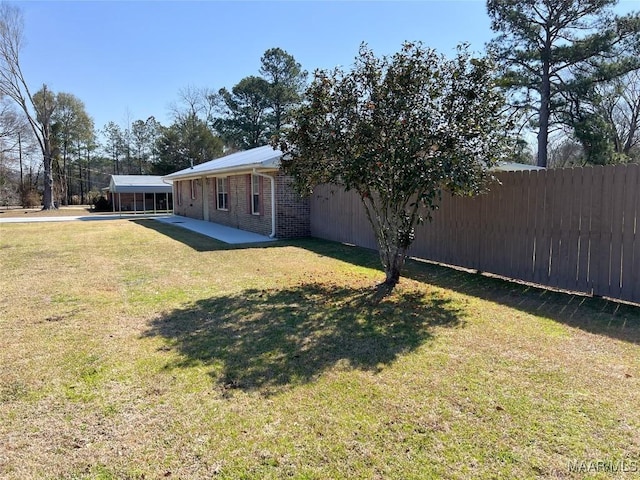 view of yard with a patio area and fence