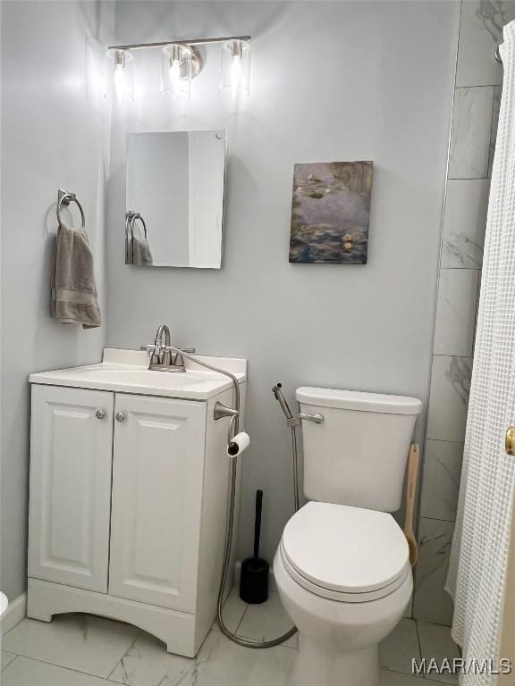 full bath featuring curtained shower, toilet, marble finish floor, and vanity