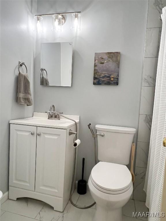 full bathroom with toilet, marble finish floor, vanity, and a shower with shower curtain