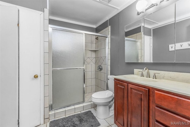 bathroom featuring tile patterned flooring, a shower stall, toilet, and vanity