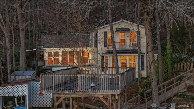 rear view of house featuring a deck