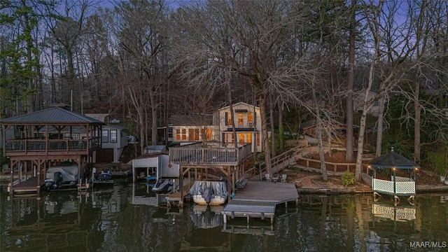 dock area featuring a gazebo, boat lift, and a water view