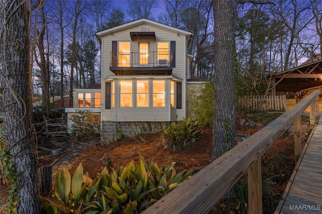 view of home's exterior featuring a balcony