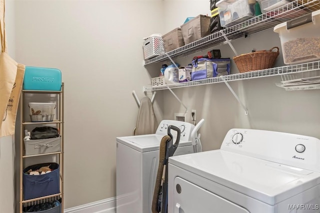 clothes washing area featuring laundry area and independent washer and dryer