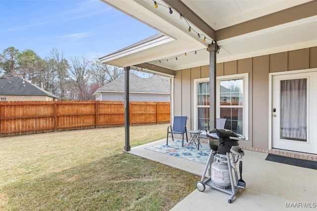 view of yard featuring a patio and fence