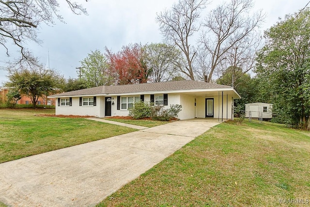 ranch-style home featuring stucco siding, an attached carport, concrete driveway, and a front lawn