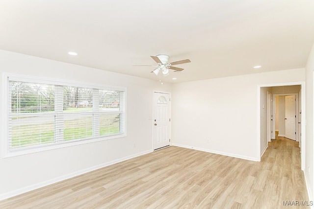 unfurnished room featuring recessed lighting, baseboards, light wood-type flooring, and ceiling fan