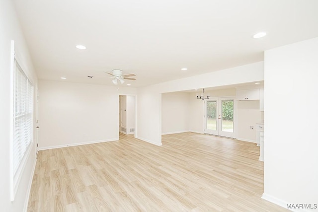 spare room with recessed lighting, baseboards, and light wood-style floors