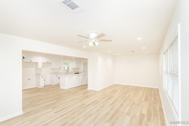 unfurnished living room featuring visible vents, baseboards, ceiling fan, recessed lighting, and light wood-style flooring