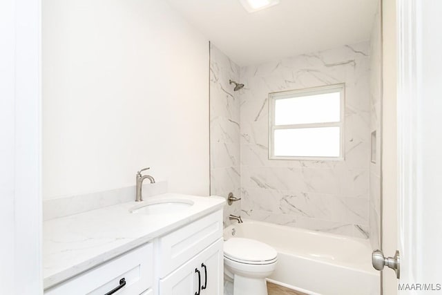 bathroom with shower / bathtub combination, toilet, and vanity
