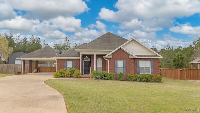 ranch-style home with driveway, a front yard, and fence