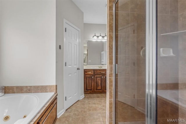 full bathroom featuring tile patterned flooring, a tub with jets, and a stall shower