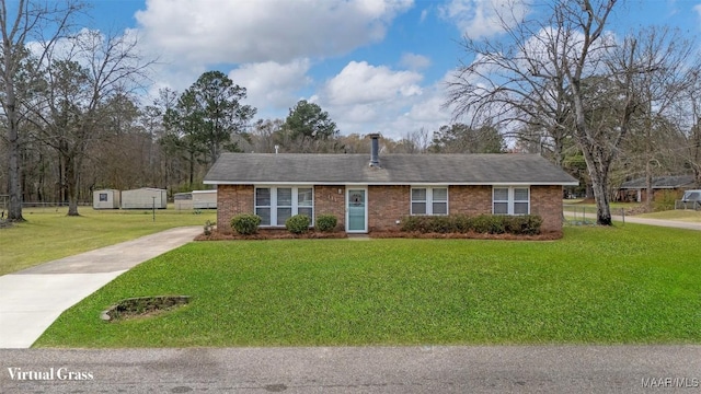 single story home featuring brick siding, concrete driveway, and a front yard