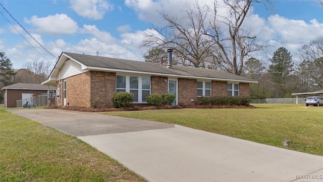 ranch-style house featuring brick siding, driveway, a front yard, and fence