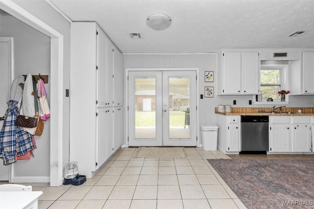 kitchen featuring visible vents, french doors, white cabinetry, and stainless steel dishwasher