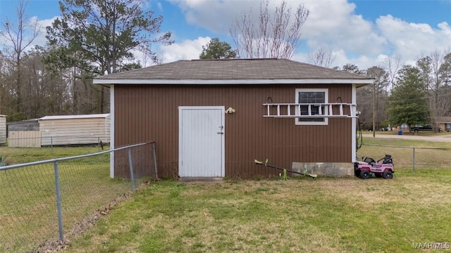 view of outbuilding with an outbuilding and fence