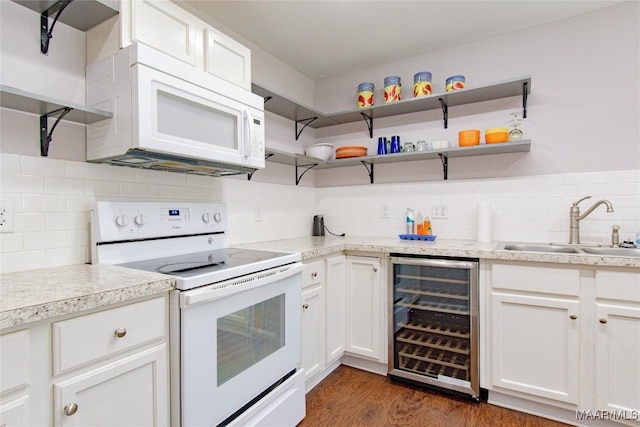 25882 Troy Hwy, Grady, AL 36036 - kitchen featuring white appliances, beverage cooler, a sink, dark wood-type flooring, and light countertops