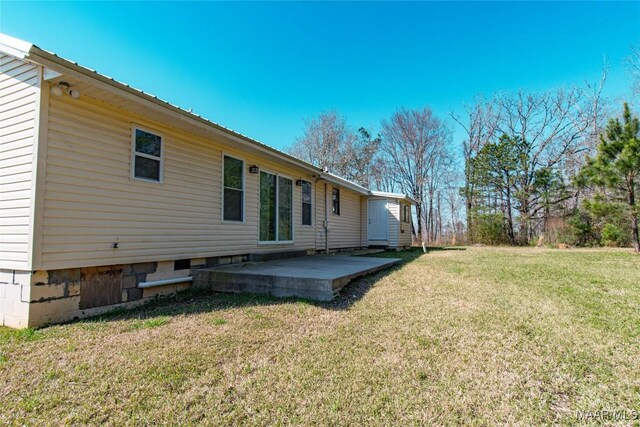 25882 Troy Hwy, Grady, AL 36036 - back of property featuring a patio area and a lawn