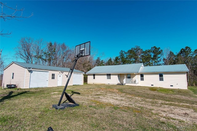 25882 Troy Hwy, Grady, AL 36036 - rear view of property with an outbuilding, a lawn, metal roof, covered porch, and crawl space