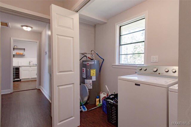 25882 Troy Hwy, Grady, AL 36036 - laundry area with dark wood-type flooring, beverage cooler, electric water heater, washing machine and dryer, and laundry area