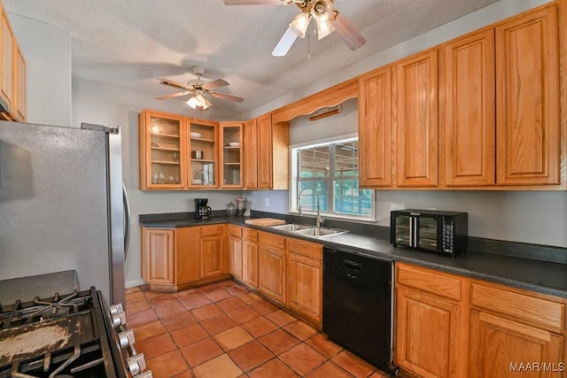 2011 Glenforest Dr, Prattville, AL 36067 - kitchen featuring dark countertops, appliances with stainless steel finishes, ceiling fan, and a sink