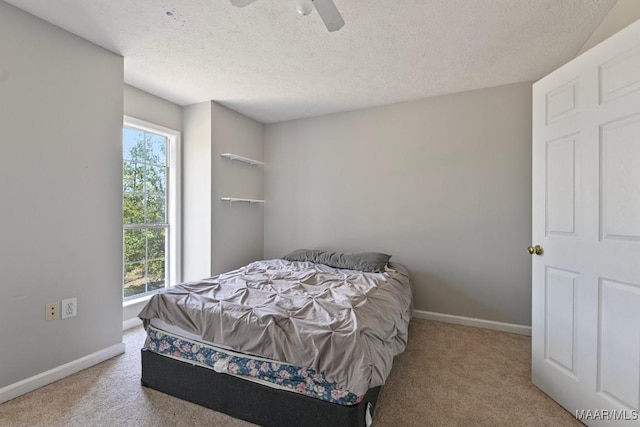2011 Glenforest Dr, Prattville, AL 36067 - carpeted bedroom with baseboards, a textured ceiling, and a ceiling fan