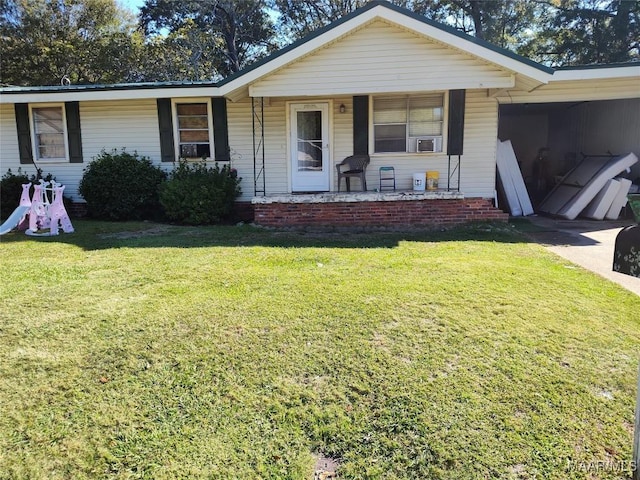 single story home with an attached carport, a front yard, and cooling unit
