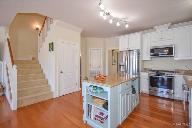 74 Lake Point Dr, Jacksons Gap, AL 36861 - kitchen featuring open shelves, stainless steel appliances, wood finished floors, and white cabinets