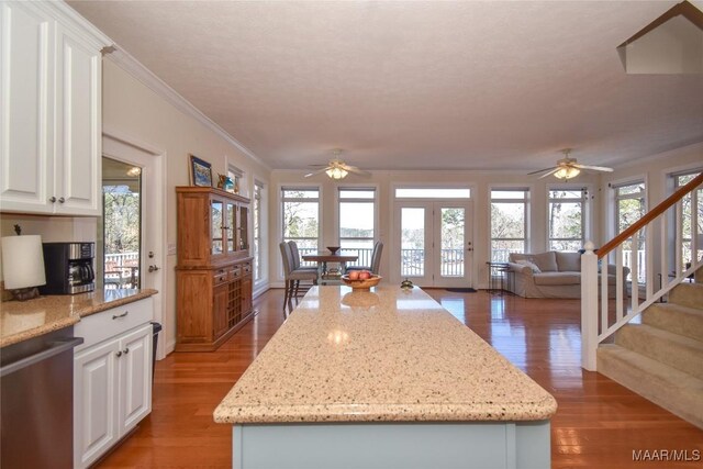 74 Lake Point Dr, Jacksons Gap, AL 36861 - kitchen with light wood-style flooring, a ceiling fan, french doors, crown molding, and dishwasher