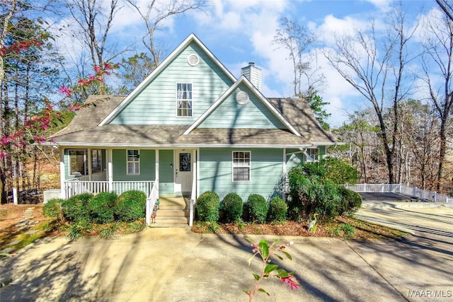 74 Lake Point Dr, Jacksons Gap, AL 36861 - view of front facade featuring covered porch and a chimney