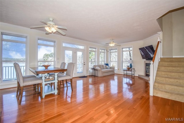 74 Lake Point Dr, Jacksons Gap, AL 36861 - dining space featuring ceiling fan, stairs, ornamental molding, light wood-style flooring, and french doors