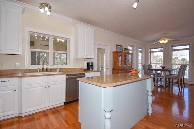 74 Lake Point Dr, Jacksons Gap, AL 36861 - kitchen featuring a sink, light wood-style floors, dishwasher, and crown molding