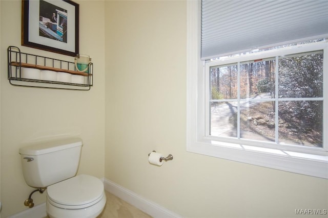 74 Lake Point Dr, Jacksons Gap, AL 36861 - bathroom featuring toilet, baseboards, and a wealth of natural light