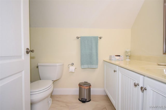 74 Lake Point Dr, Jacksons Gap, AL 36861 - bathroom with vanity, lofted ceiling, toilet, and baseboards