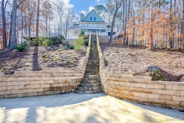 74 Lake Point Dr, Jacksons Gap, AL 36861 - rear view of property featuring stairs, a patio, and a porch