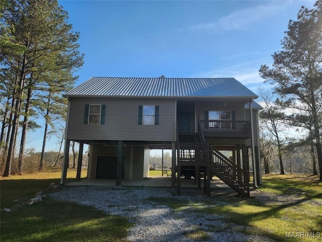2085 Robinson Pond Rd, Prattville, AL 36067 - view of front of home featuring stairs, a carport, driveway, and metal roof